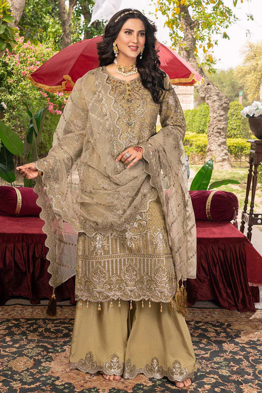 Woman in traditional embroidered outfit standing outdoors with a red umbrella and garden background