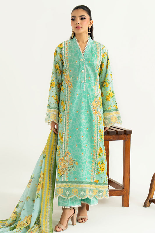 Woman wearing a light blue embroidered traditional outfit with yellow patterns on a white background