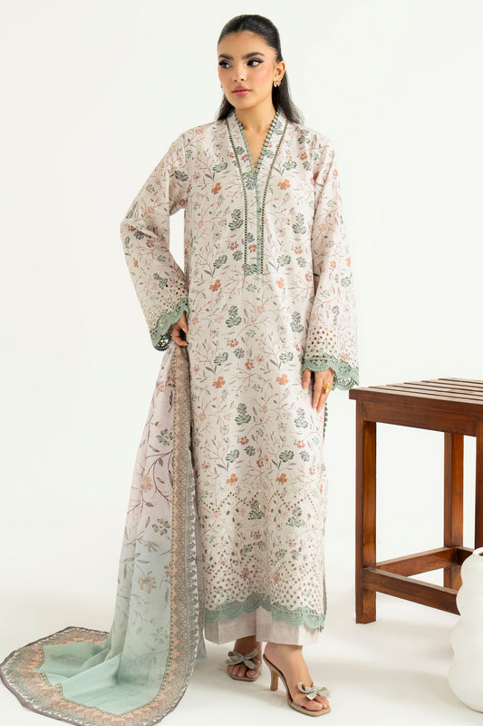 Woman wearing a floral dress with a wooden stool in the background
