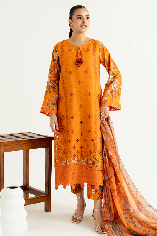 Woman wearing an orange embroidered traditional outfit with a wooden stool and white background