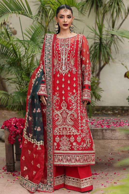 Woman wearing a red embroidered traditional outfit with a floral background