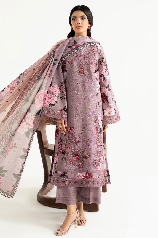 Woman wearing a floral embroidered outfit with a matching dupatta on a white background