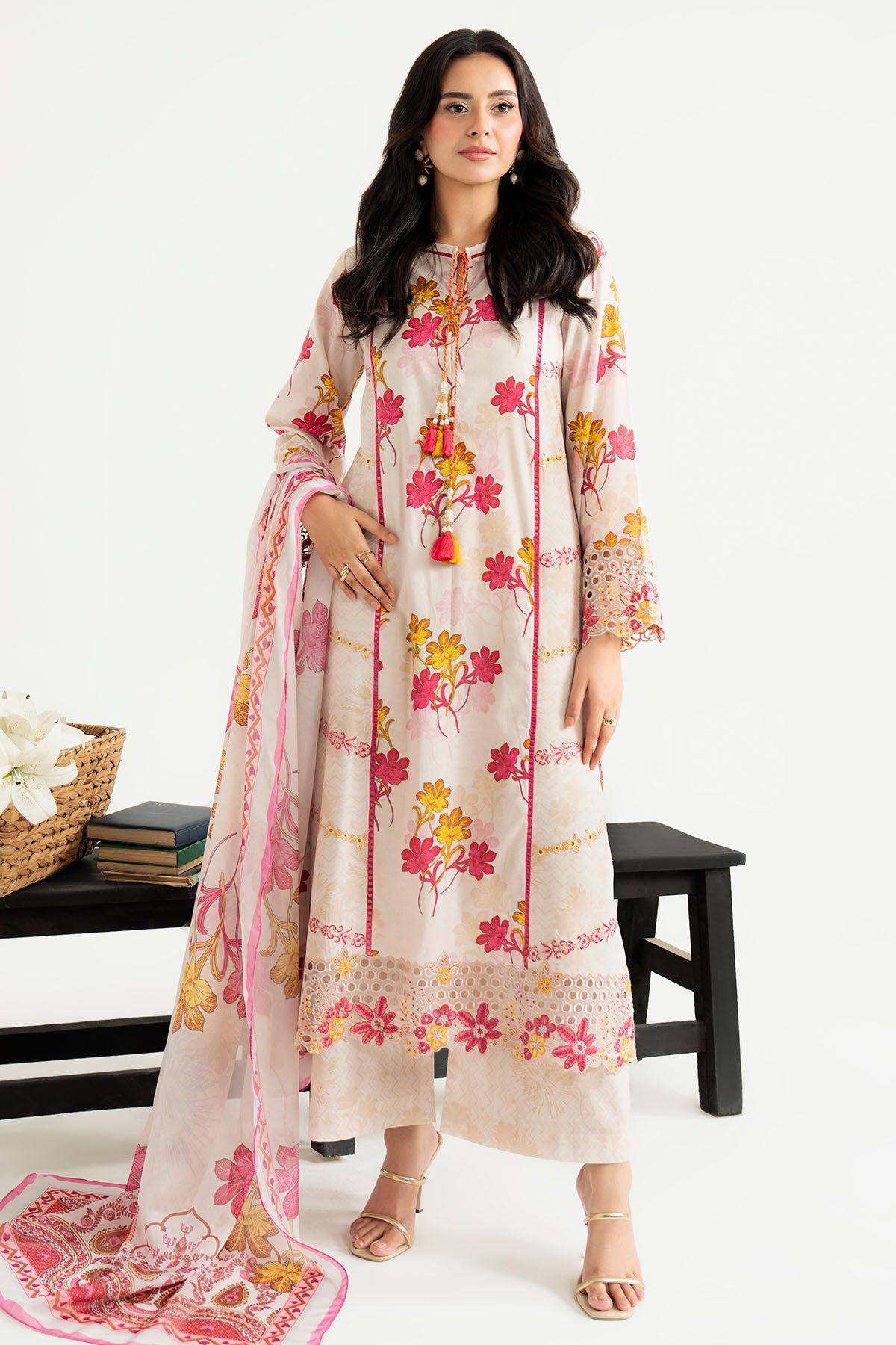 Woman wearing a floral dress with a white background