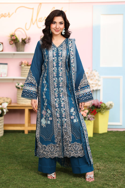 A woman wearing a blue lawn ensemble with embroidered details, including a shirt, dupatta, and trousers.